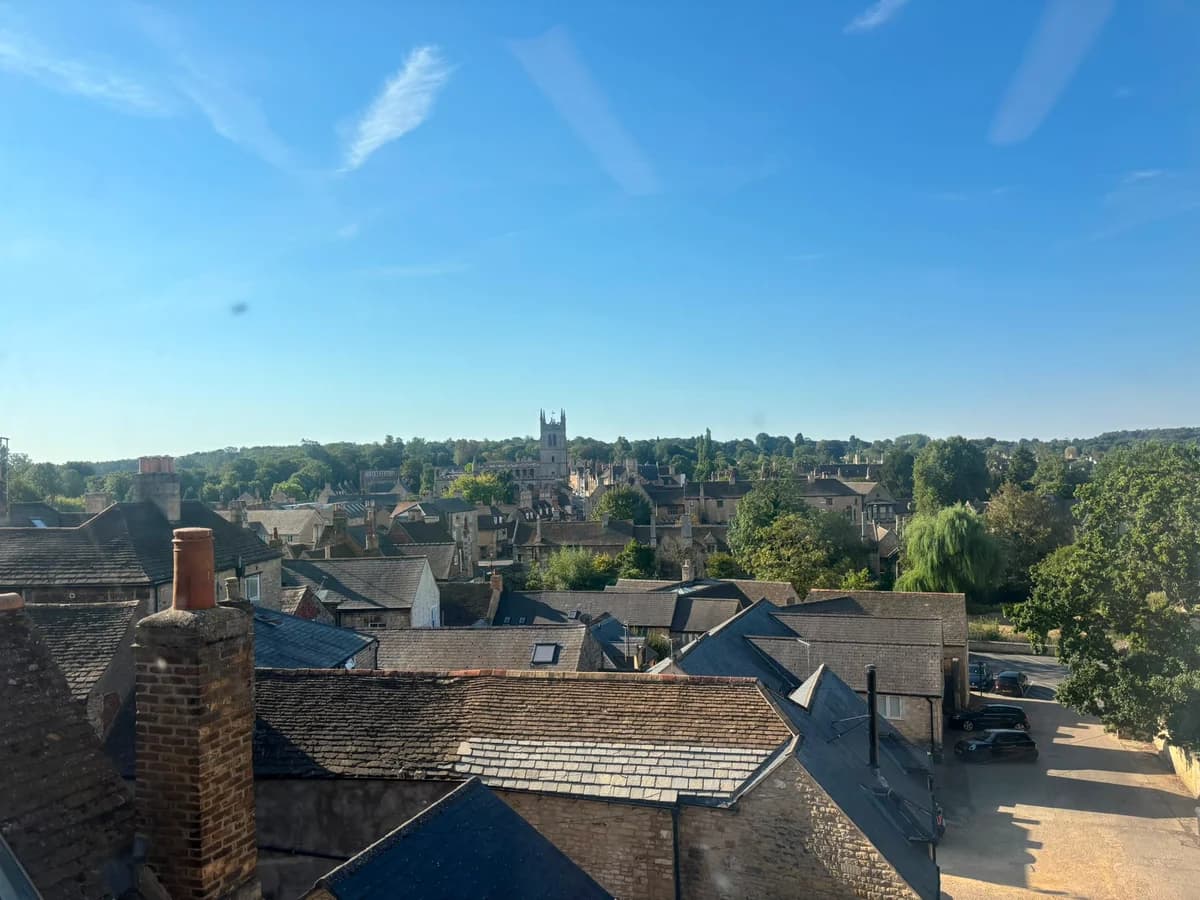 View over Stamford's stone rooftops and church tower from the surgery window